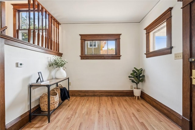 395 18th St SE, Cedar Rapids, IA 52403 - corridor with light wood finished floors and baseboards