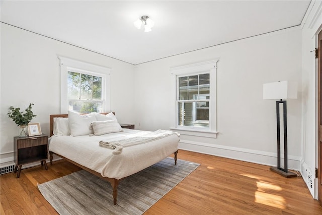 395 18th St SE, Cedar Rapids, IA 52403 - bedroom with light wood-style floors and baseboards