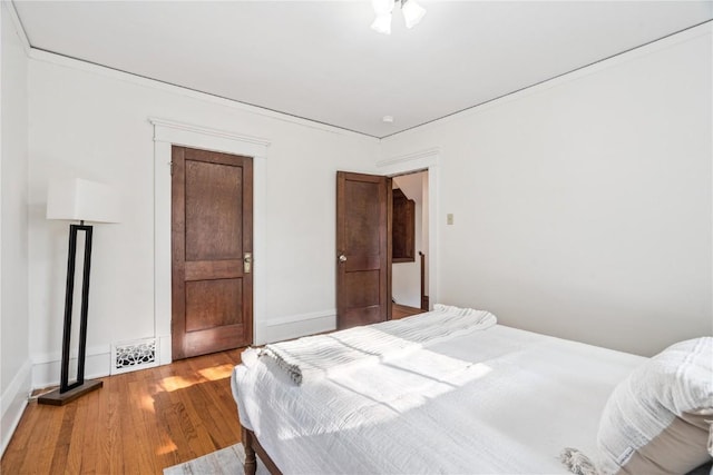 395 18th St SE, Cedar Rapids, IA 52403 - bedroom with wood finished floors and baseboards