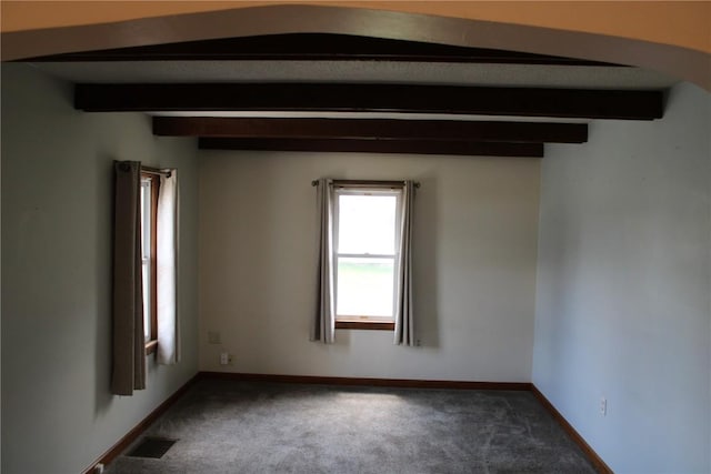 302 S Main St, Monticello, IA 52310 - carpeted empty room featuring beamed ceiling