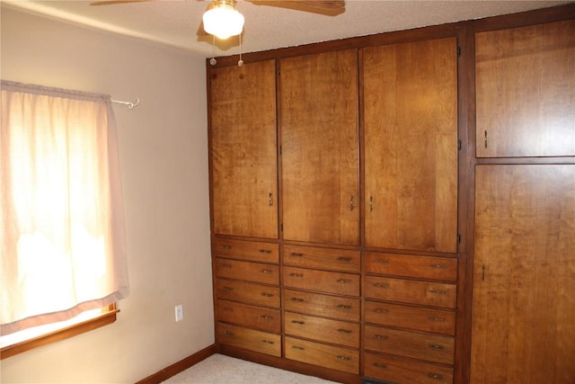 302 S Main St, Monticello, IA 52310 - unfurnished bedroom featuring a ceiling fan and light colored carpet