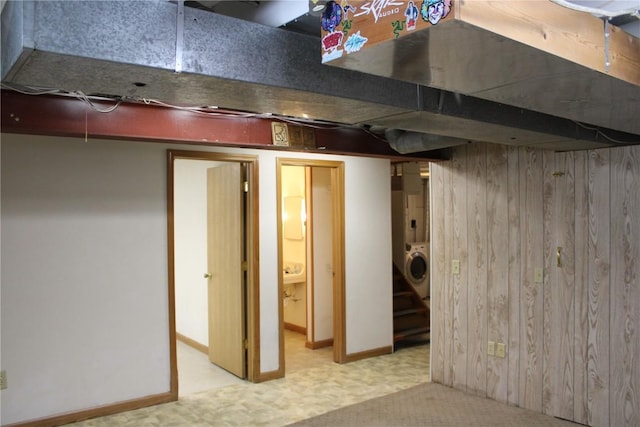 302 S Main St, Monticello, IA 52310 - finished basement with washer / clothes dryer, wooden walls, and carpet