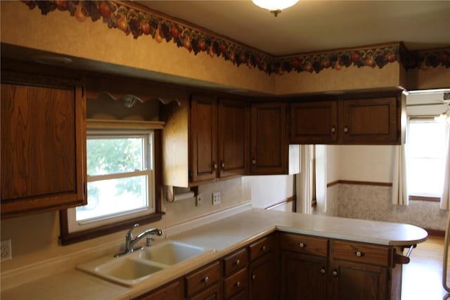 302 S Main St, Monticello, IA 52310 - kitchen featuring light countertops and a peninsula