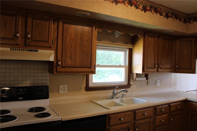 302 S Main St, Monticello, IA 52310 - kitchen featuring white range with electric stovetop, under cabinet range hood, dishwasher, light countertops, and tasteful backsplash