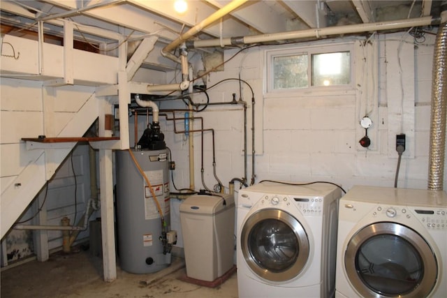 302 S Main St, Monticello, IA 52310 - washroom with water heater, separate washer and dryer, and concrete block wall