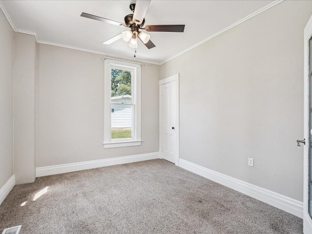226 2nd Ave E, Lisbon, IA 52253 - empty room featuring carpet floors, ornamental molding, and ceiling fan