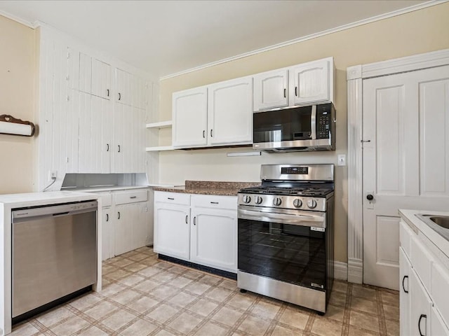 226 2nd Ave E, Lisbon, IA 52253 - kitchen featuring stainless steel appliances, open shelves, white cabinets, light flooring, and ornamental molding