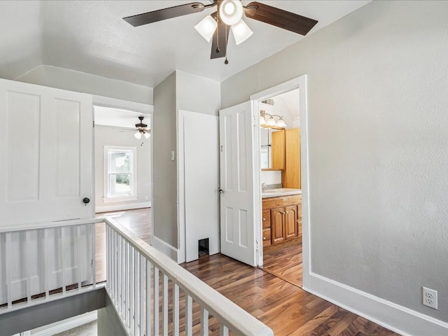 226 2nd Ave E, Lisbon, IA 52253 - hall with baseboards and wood finished floors