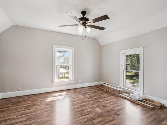 226 2nd Ave E, Lisbon, IA 52253 - spare room featuring lofted ceiling, healthy amount of natural light, a ceiling fan, and wood finished floors