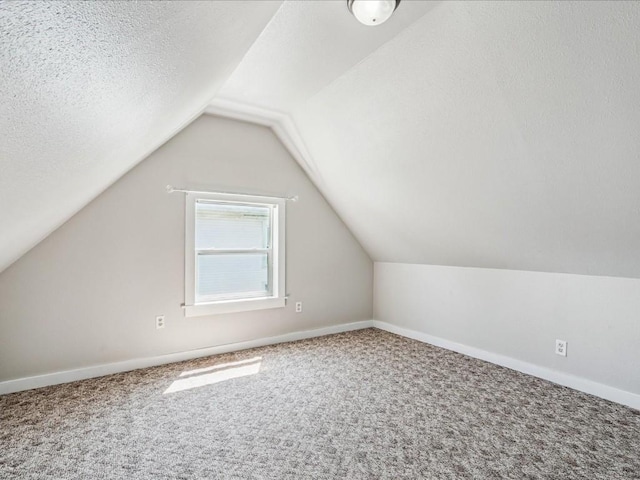 226 2nd Ave E, Lisbon, IA 52253 - additional living space featuring carpet and vaulted ceiling