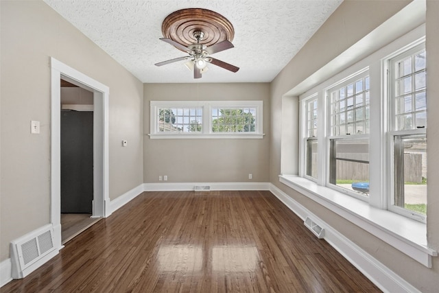 351 19th St SE, Cedar Rapids, IA 52403 - empty room with a textured ceiling, dark wood-style flooring, and a ceiling fan