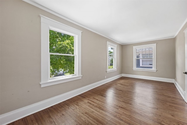 351 19th St SE, Cedar Rapids, IA 52403 - spare room with crown molding and dark wood-style floors