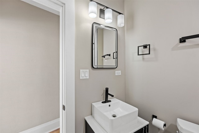 351 19th St SE, Cedar Rapids, IA 52403 - bathroom featuring toilet and vanity