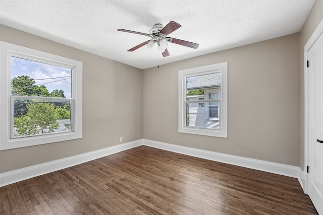 351 19th St SE, Cedar Rapids, IA 52403 - spare room featuring dark wood-style floors, ceiling fan, and a textured ceiling