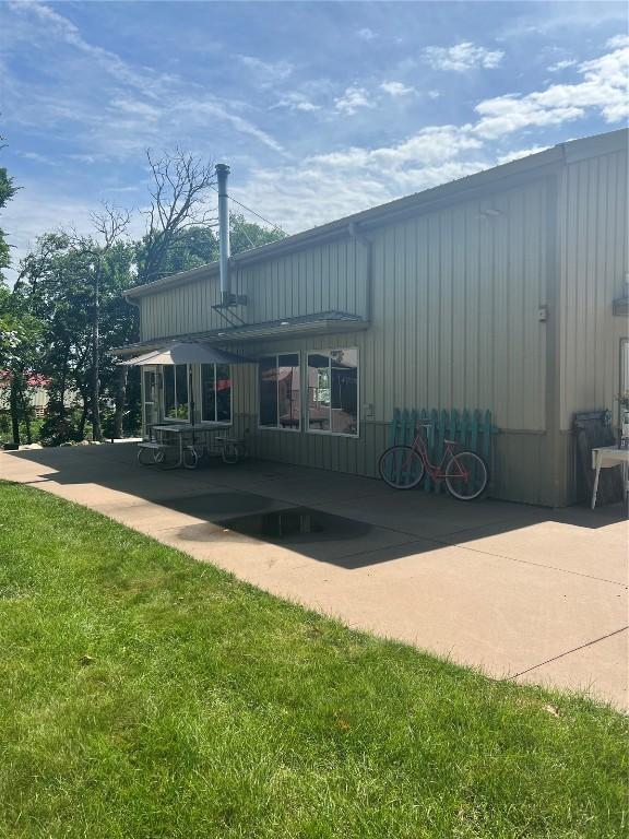 101 Canyon Rd, Montezuma, IA 50171 - back of property featuring a patio area and a yard