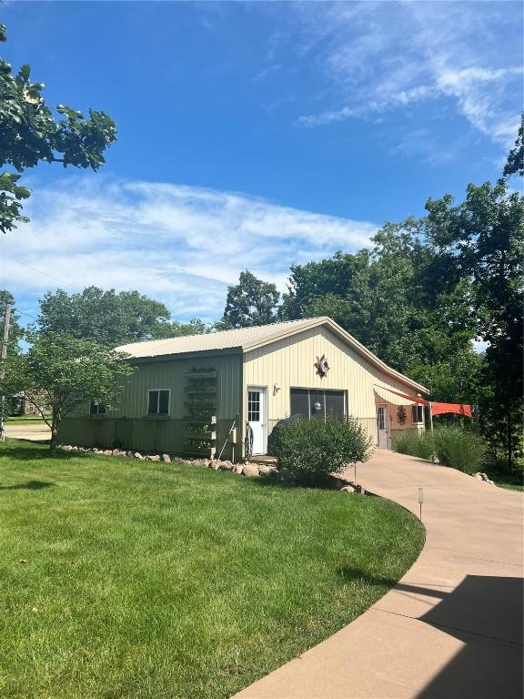 101 Canyon Rd, Montezuma, IA 50171 - view of front of house with a front yard and concrete driveway