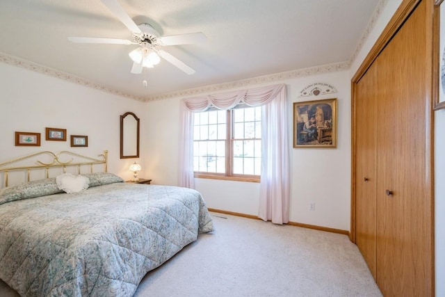 1827 Hamer Dr NW, Cedar Rapids, IA 52405 - bedroom featuring light carpet, a closet, and ceiling fan