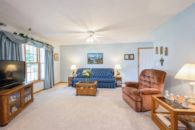 1827 Hamer Dr NW, Cedar Rapids, IA 52405 - living area with light carpet and a ceiling fan