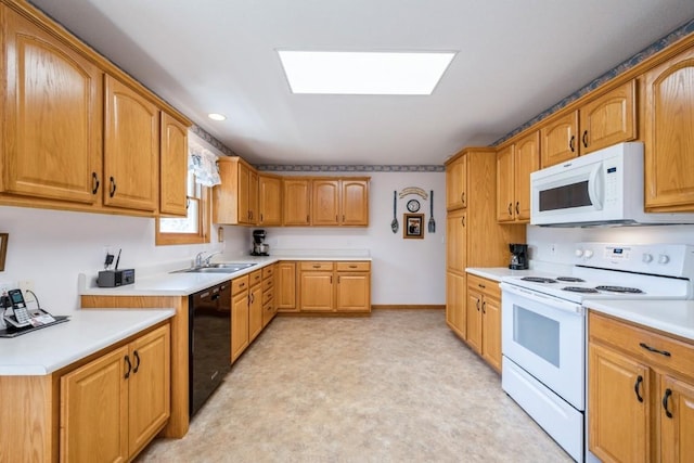 1827 Hamer Dr NW, Cedar Rapids, IA 52405 - kitchen with white appliances, a skylight, light countertops, and recessed lighting