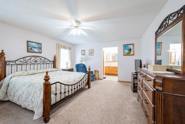 1827 Hamer Dr NW, Cedar Rapids, IA 52405 - bedroom with light carpet, connected bathroom, and a ceiling fan