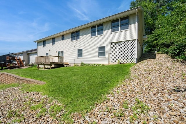1827 Hamer Dr NW, Cedar Rapids, IA 52405 - back of house featuring a lawn and a deck