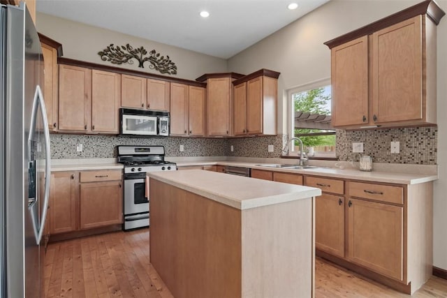 2012 Radcliffe Dr SW, Cedar Rapids, IA 52404 - kitchen with appliances with stainless steel finishes, light wood-type flooring, decorative backsplash, light countertops, and recessed lighting