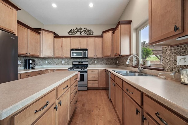 2012 Radcliffe Dr SW, Cedar Rapids, IA 52404 - kitchen with stainless steel appliances, light wood-type flooring, decorative backsplash, recessed lighting, and light countertops
