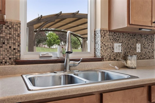 2012 Radcliffe Dr SW, Cedar Rapids, IA 52404 - kitchen featuring light countertops and backsplash