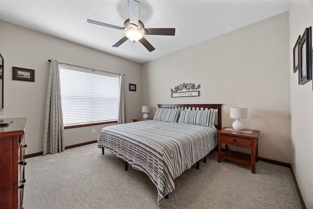2012 Radcliffe Dr SW, Cedar Rapids, IA 52404 - carpeted bedroom featuring a ceiling fan and a textured ceiling
