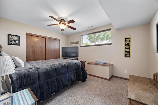 2012 Radcliffe Dr SW, Cedar Rapids, IA 52404 - bedroom with a closet, light colored carpet, and a ceiling fan