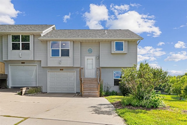 1361 Ozark Rdg, Coralville, IA 52241 - raised ranch with concrete driveway and an attached garage