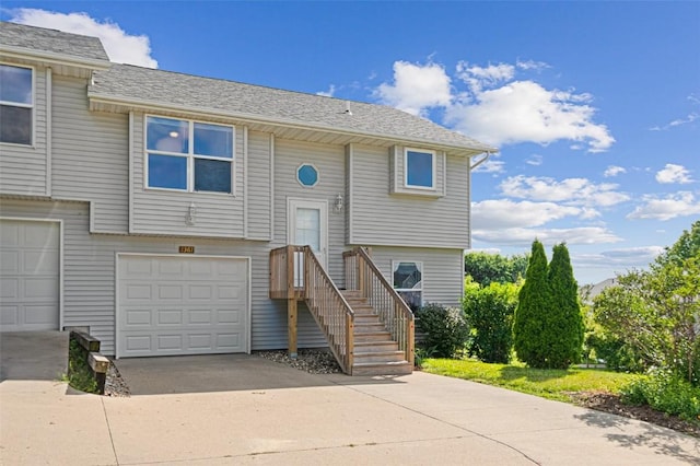 1361 Ozark Rdg, Coralville, IA 52241 - bi-level home with driveway and a garage