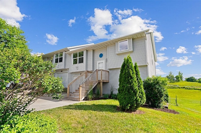 1361 Ozark Rdg, Coralville, IA 52241 - view of front of home featuring a front lawn and an attached garage