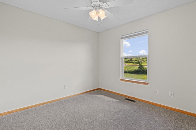 1361 Ozark Rdg, Coralville, IA 52241 - carpeted spare room with baseboards and ceiling fan
