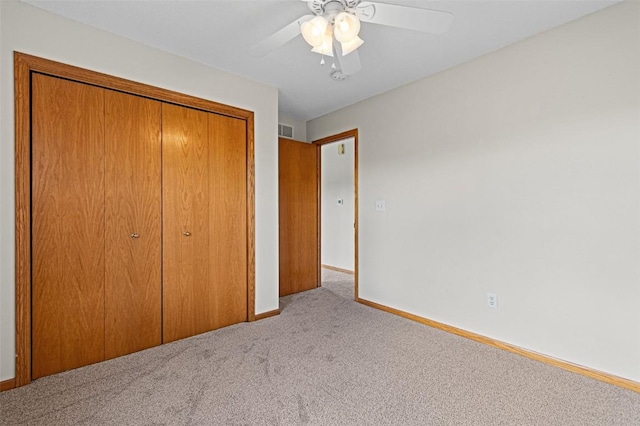 1361 Ozark Rdg, Coralville, IA 52241 - unfurnished bedroom with carpet flooring, a closet, and a ceiling fan