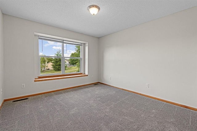 1361 Ozark Rdg, Coralville, IA 52241 - carpeted spare room with baseboards and a textured ceiling