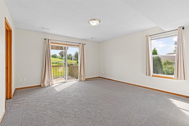 1361 Ozark Rdg, Coralville, IA 52241 - carpeted spare room with baseboards and a textured ceiling