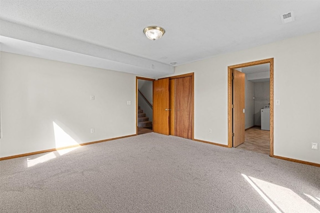 1361 Ozark Rdg, Coralville, IA 52241 - unfurnished bedroom with carpet, a closet, and washer / dryer