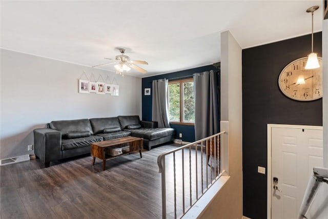 1654 19th St NW, Cedar Rapids, IA 52405 - living room with a ceiling fan and dark wood-style flooring