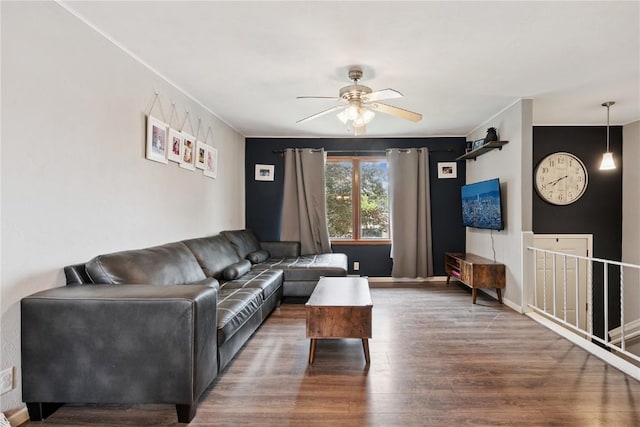 1654 19th St NW, Cedar Rapids, IA 52405 - living area featuring a ceiling fan, wood finished floors, and crown molding
