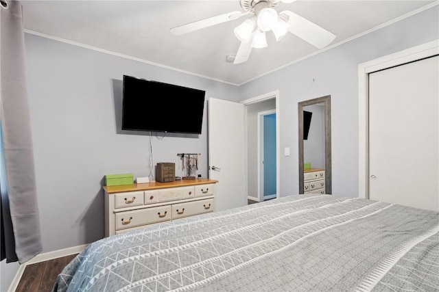 1654 19th St NW, Cedar Rapids, IA 52405 - bedroom with wood finished floors, crown molding, ceiling fan, and a closet