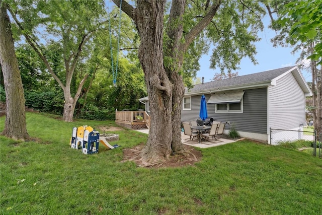 1654 19th St NW, Cedar Rapids, IA 52405 - view of yard featuring a deck and a patio