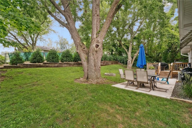 1654 19th St NW, Cedar Rapids, IA 52405 - view of yard with a patio and a wooden deck