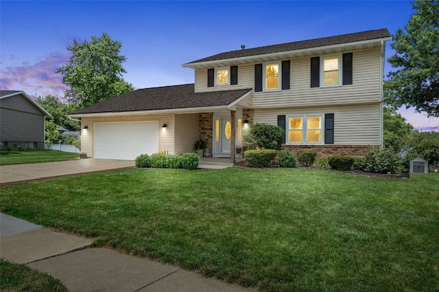 364 Essex Dr NE, Cedar Rapids, IA 52402 - view of front of property featuring an attached garage, concrete driveway, a yard, and brick siding