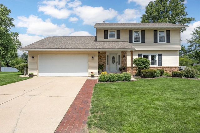 364 Essex Dr NE, Cedar Rapids, IA 52402 - traditional-style home with driveway, a front yard, a garage, brick siding, and roof with shingles