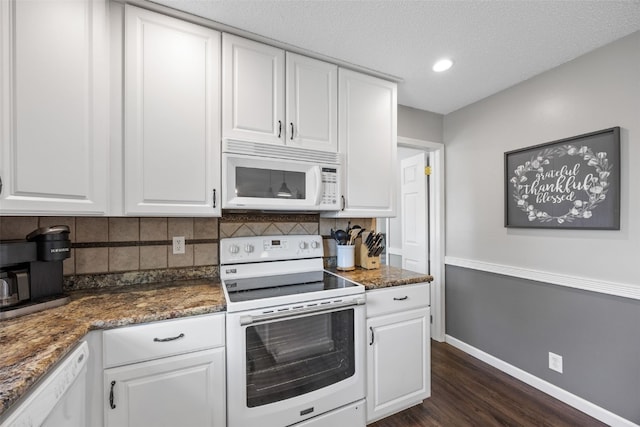364 Essex Dr NE, Cedar Rapids, IA 52402 - kitchen featuring white appliances, dark wood-type flooring, backsplash, white cabinetry, and recessed lighting