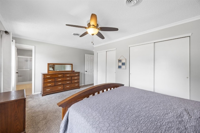 364 Essex Dr NE, Cedar Rapids, IA 52402 - carpeted bedroom with two closets, ornamental molding, a ceiling fan, and a textured ceiling