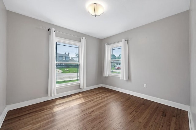2500 D Ave NE, Cedar Rapids, IA 52402 - unfurnished room featuring wood finished floors and baseboards