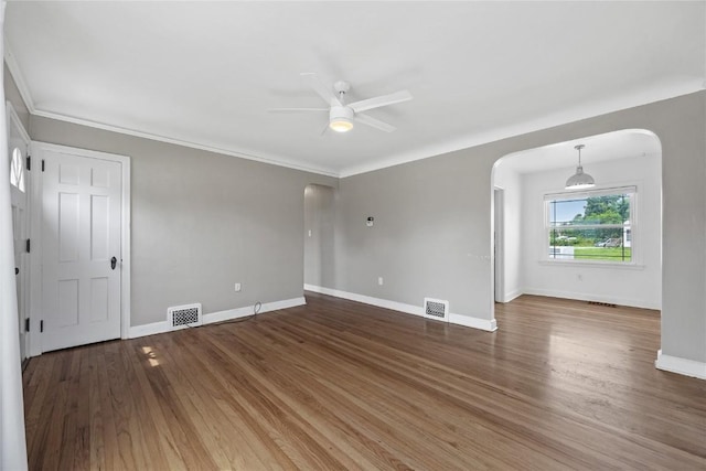 2500 D Ave NE, Cedar Rapids, IA 52402 - spare room featuring arched walkways, ceiling fan, and wood finished floors