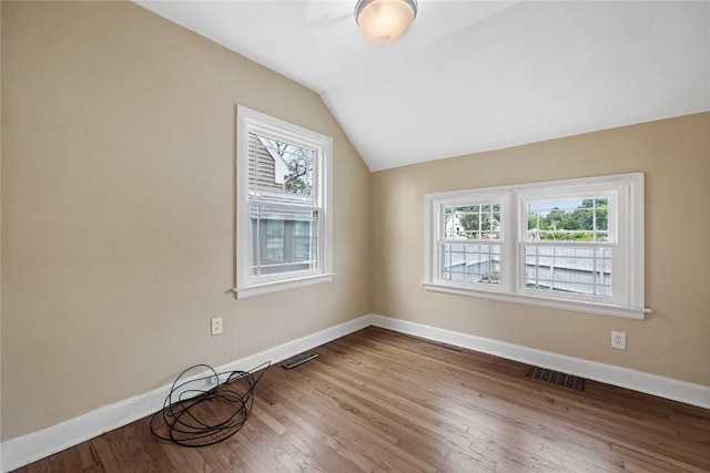 2500 D Ave NE, Cedar Rapids, IA 52402 - unfurnished room with vaulted ceiling and wood finished floors